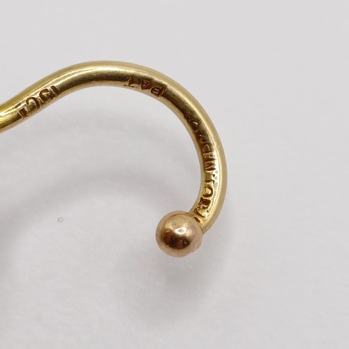 572 - A late 19th/early 20th century yellow metal and pearl stick pin, in the form of a noose  Provenance:... 