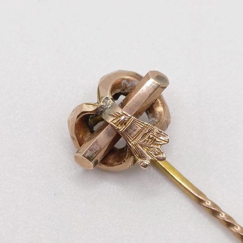 567 - A late 19th/early 20th century yellow metal stick pin  Provenance:  From a single owner collection o... 