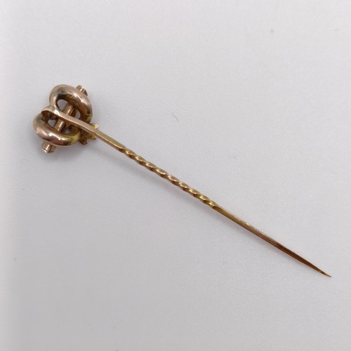 567 - A late 19th/early 20th century yellow metal stick pin  Provenance:  From a single owner collection o... 