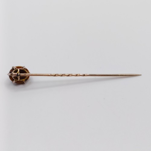 566 - A 20th century yellow metal and tiger's eye stick pin Provenance:  From a single owner collection of... 