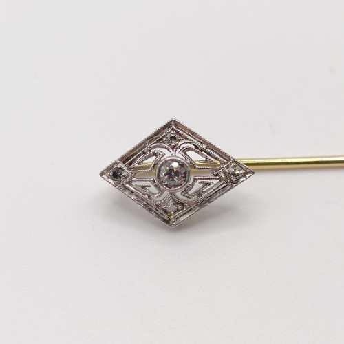 564 - An early 20th century silver coloured metal and yellow metal stick pin  Provenance:  From a single o... 