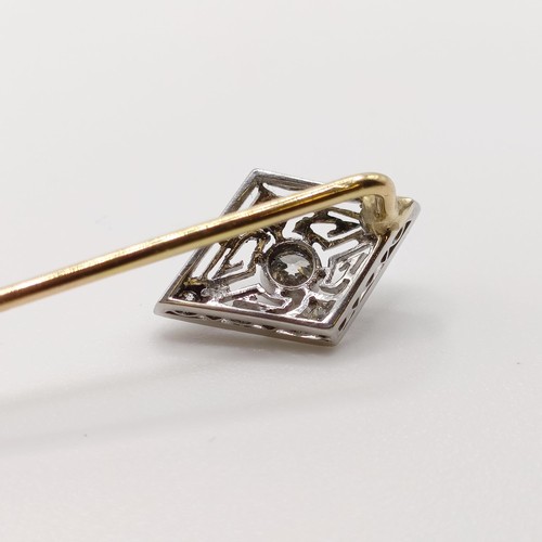 564 - An early 20th century silver coloured metal and yellow metal stick pin  Provenance:  From a single o... 