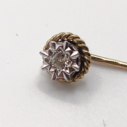 557 - A late 19th/early 20th century silver coloured metal, yellow metal and diamond stick pin  Provenance... 