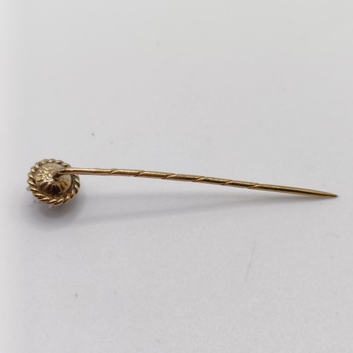 557 - A late 19th/early 20th century silver coloured metal, yellow metal and diamond stick pin  Provenance... 