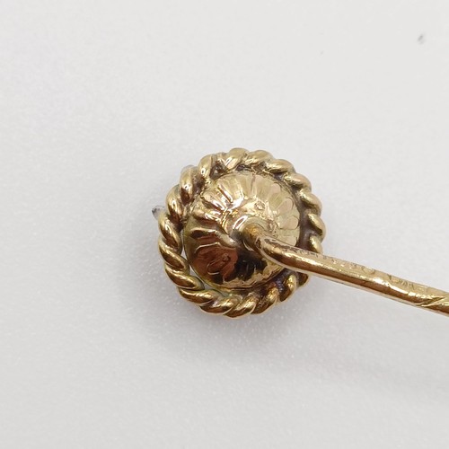 557 - A late 19th/early 20th century silver coloured metal, yellow metal and diamond stick pin  Provenance... 