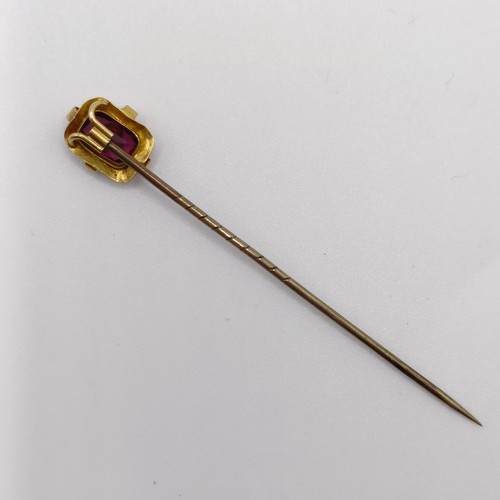 556 - A late 19th/early 20th century yellow metal, amethyst and seed pearl stick pin  Provenance:  From a ... 