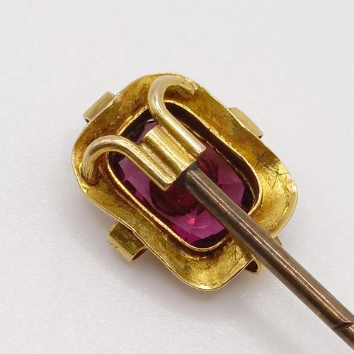 556 - A late 19th/early 20th century yellow metal, amethyst and seed pearl stick pin  Provenance:  From a ... 