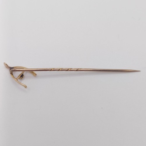 550 - A late 19th/early 20th century yellow metal and diamond stick pin, in the form of a wishbone  Proven... 