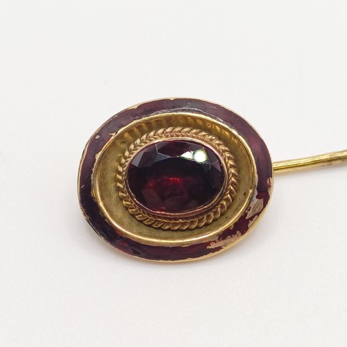 548 - A late 19th/early 20th century yellow coloured metal, red stone and red enamel stick pin  Provenance... 