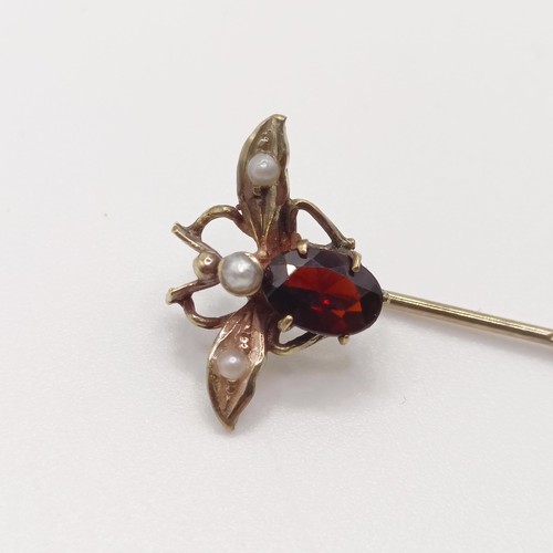 547 - A late 19th/early 20th century yellow metal red stone and seed pearl stick pin, in the form of a fly... 