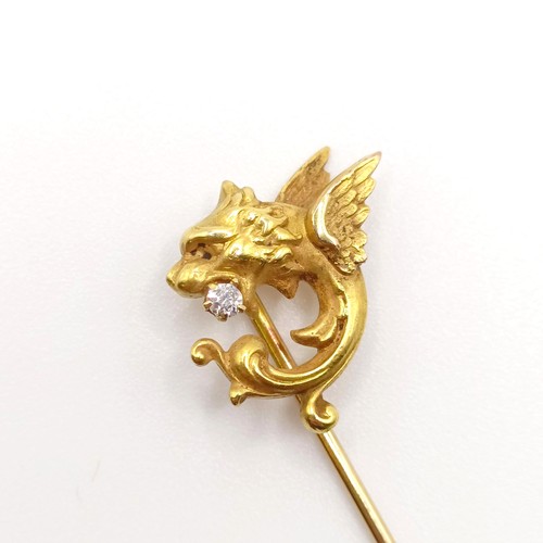 545 - A late 19th/early 20th century yellow coloured metal and diamond stick pin, in the form of a dragon ... 