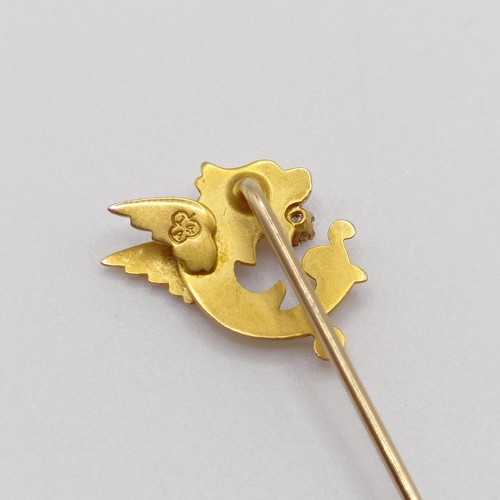 545 - A late 19th/early 20th century yellow coloured metal and diamond stick pin, in the form of a dragon ... 