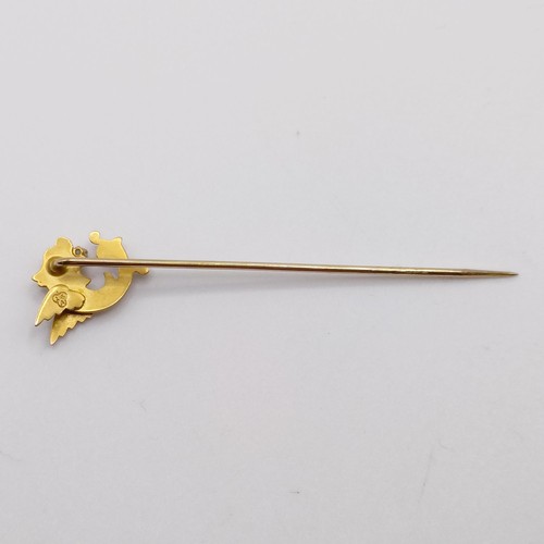 545 - A late 19th/early 20th century yellow coloured metal and diamond stick pin, in the form of a dragon ... 