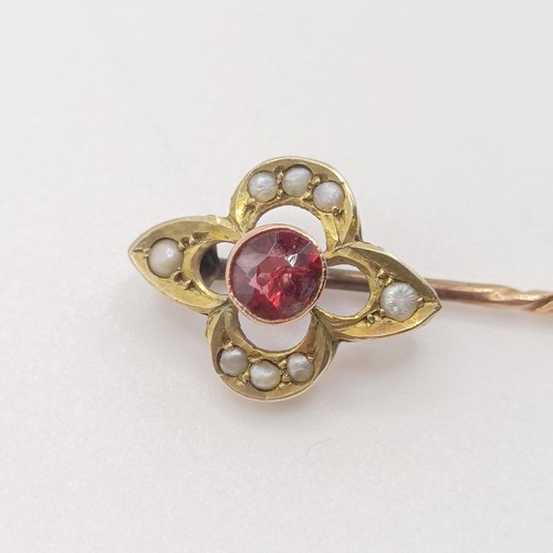 541 - A late 19th/early 20th century yellow metal, garnet and seed pearl stick pin  Provenance:  From a si... 