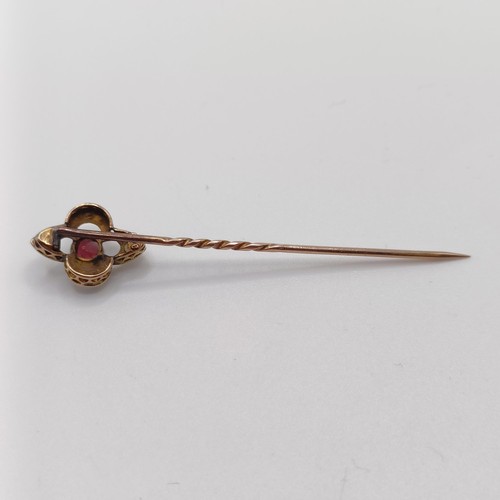 541 - A late 19th/early 20th century yellow metal, garnet and seed pearl stick pin  Provenance:  From a si... 