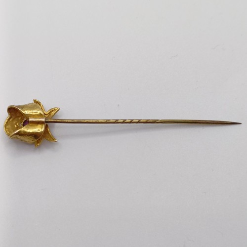 540 - An early 20th century yellow metal, pink stone and seed pearl stick pin  Provenance:  From a single ... 