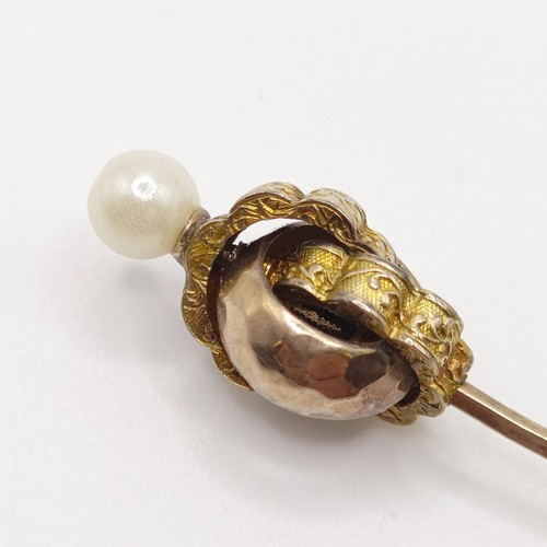 539 - A late 19th/early 20th century yellow metal and cultured pearl stick pin  Provenance:  From a single... 