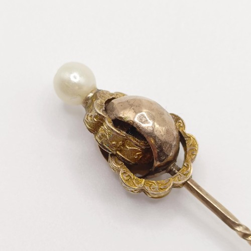 539 - A late 19th/early 20th century yellow metal and cultured pearl stick pin  Provenance:  From a single... 