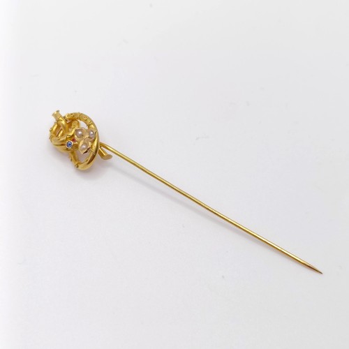 538 - A late 19th/early 20th century yellow metal, sapphire and seed pearl stick pin  Provenance:  From a ... 