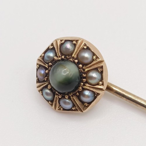 535 - A late 19th/early 20th century yellow metal, seed pearl and tiger's eye stick pin  Provenance:  From... 