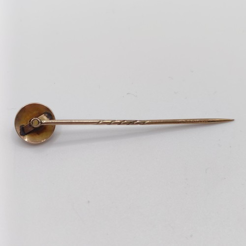 535 - A late 19th/early 20th century yellow metal, seed pearl and tiger's eye stick pin  Provenance:  From... 