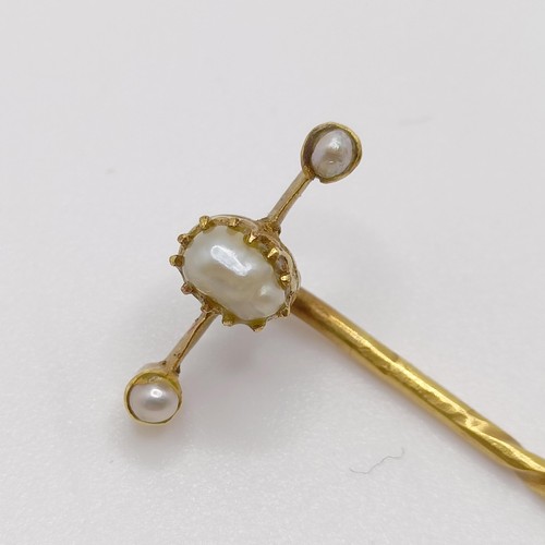 534 - An early 20th century yellow metal and pearl stick pin  Provenance:  From a single owner collection ... 