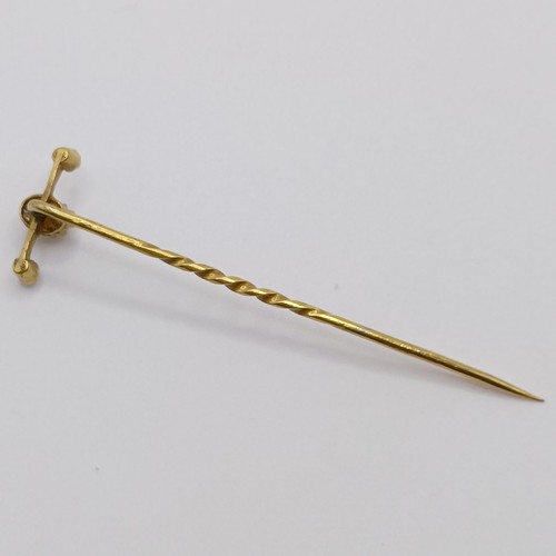 534 - An early 20th century yellow metal and pearl stick pin  Provenance:  From a single owner collection ... 