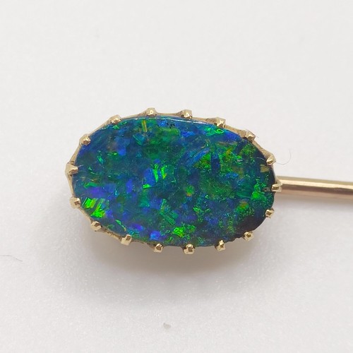 533 - A 20th century, yellow coloured metal and opal stick pin  Provenance:  From a single owner collectio... 