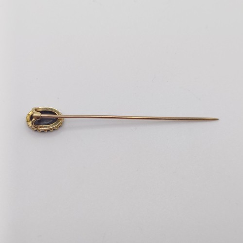 533 - A 20th century, yellow coloured metal and opal stick pin  Provenance:  From a single owner collectio... 