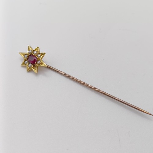 532 - An early 20th century silver coloured metal, yellow coloured metal, ruby and seed pearl stick pin  P... 