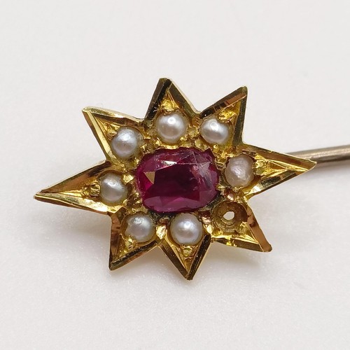 532 - An early 20th century silver coloured metal, yellow coloured metal, ruby and seed pearl stick pin  P... 