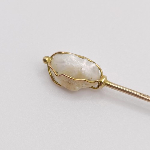 529 - A yellow metal and cultured pearl stick pin  Provenance:  From a single owner collection of Victoria... 