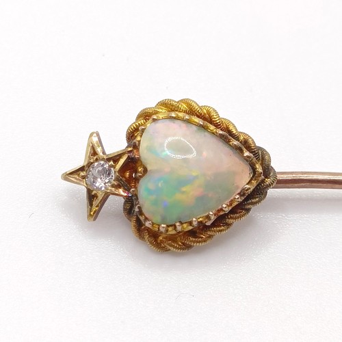 526 - A late 19th/early 20th century yellow metal, opal and diamond stick pin, in the form of a heart belo... 