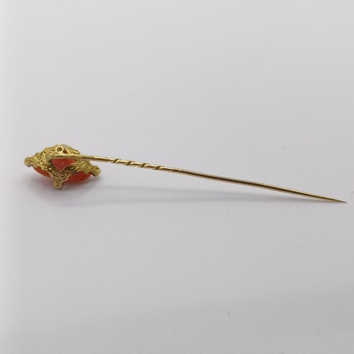 521 - A 20th century yellow metal, coral and white stone stick pin
Provenance:  From a single owner collec... 