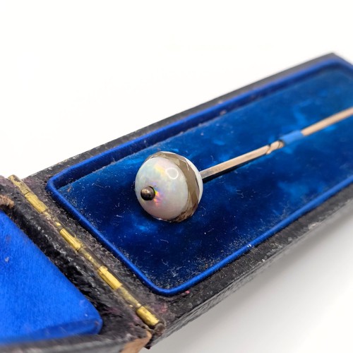 516 - An early 20th century opal and white stone stick pin, in a vintage jewellery box   Provenance:  From... 