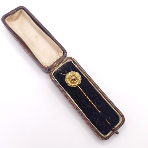 512 - A late 19th/early 20th century yellow metal stick pin, in a vintage jewellery box  Provenance:  From... 