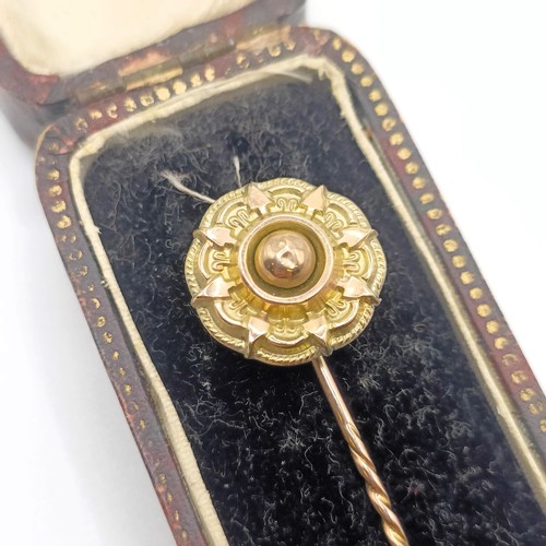 512 - A late 19th/early 20th century yellow metal stick pin, in a vintage jewellery box  Provenance:  From... 