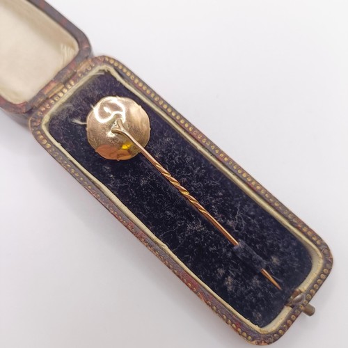 512 - A late 19th/early 20th century yellow metal stick pin, in a vintage jewellery box  Provenance:  From... 