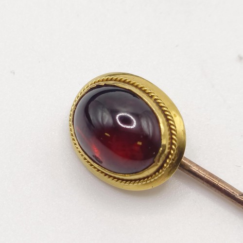 507 - A 19th century cabochon cut garnet stick pin, in a vintage jewellery box  Provenance:  From a single... 