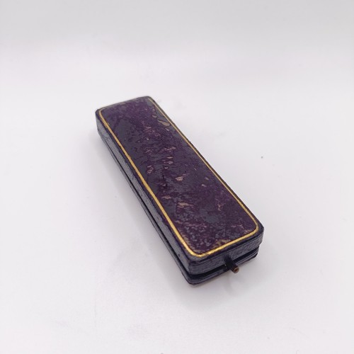 507 - A 19th century cabochon cut garnet stick pin, in a vintage jewellery box  Provenance:  From a single... 