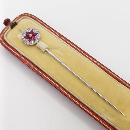 502 - An early 20th century diamond and ruby stick pin, in a vintage jewellery box  Provenance:  From a si... 