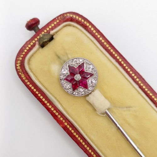 502 - An early 20th century diamond and ruby stick pin, in a vintage jewellery box  Provenance:  From a si... 