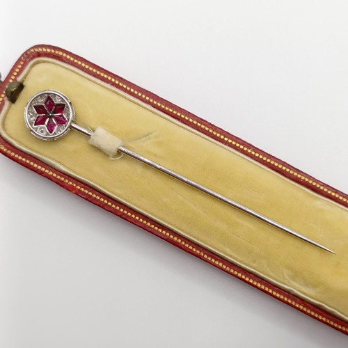 502 - An early 20th century diamond and ruby stick pin, in a vintage jewellery box  Provenance:  From a si... 