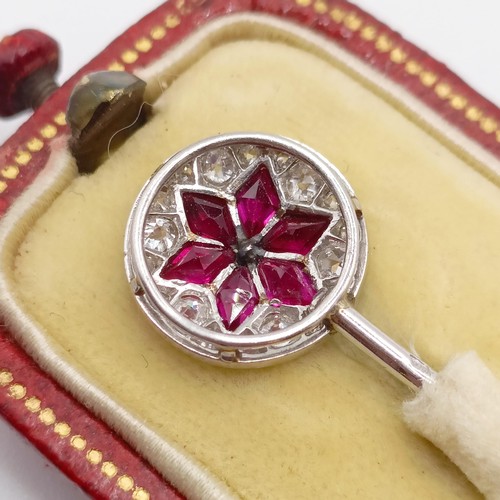 502 - An early 20th century diamond and ruby stick pin, in a vintage jewellery box  Provenance:  From a si... 