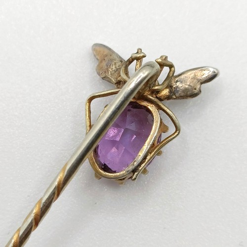 504 - A 19th century amethyst and seed pearl stick pin, in the form of a fly, in a vintage jewellery case ... 