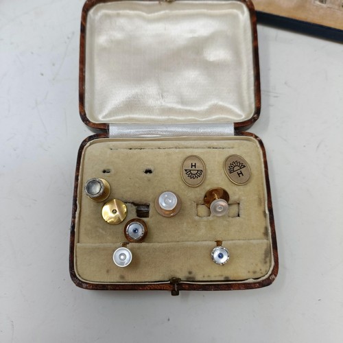 664 - A 9ct gold and mother of pearl pair of buttons, assorted other buttons, a pair of studs, assorted cu... 