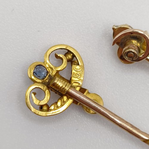 662 - An early 20th century yellow metal, sapphire and seed pearl stick pin, and an early 20th century yel... 