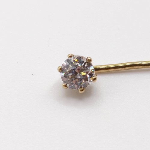 661 - A 20th century yellow coloured metal and diamond solitaire stick pin Provenance:  From a single owne... 