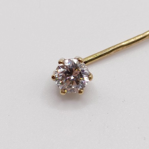 661 - A 20th century yellow coloured metal and diamond solitaire stick pin Provenance:  From a single owne... 