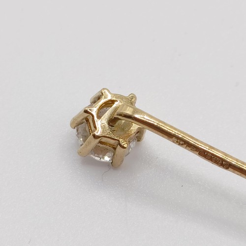 661 - A 20th century yellow coloured metal and diamond solitaire stick pin Provenance:  From a single owne... 